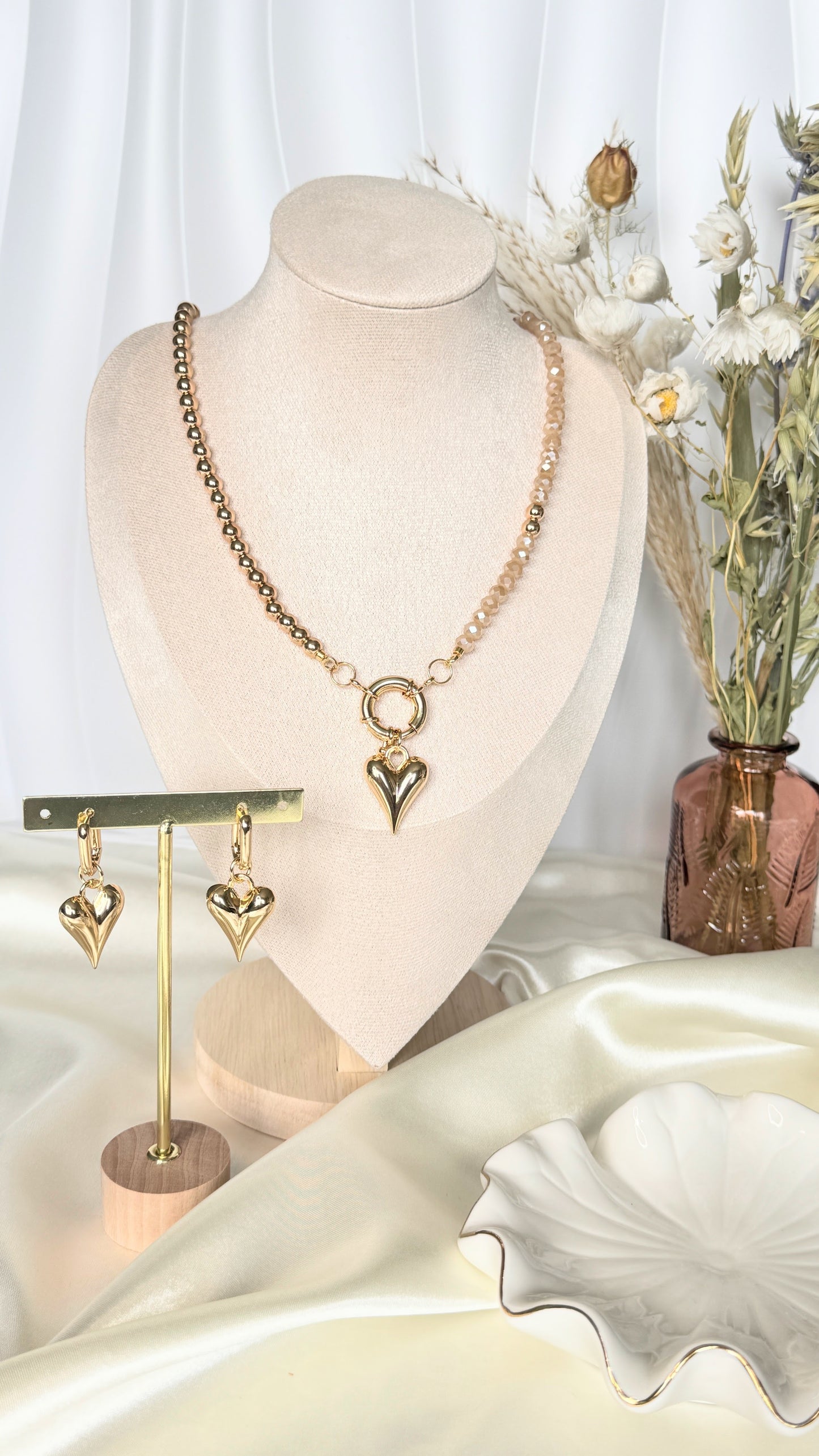 Hematite golden crystal necklace and earrings jewelry set on white background