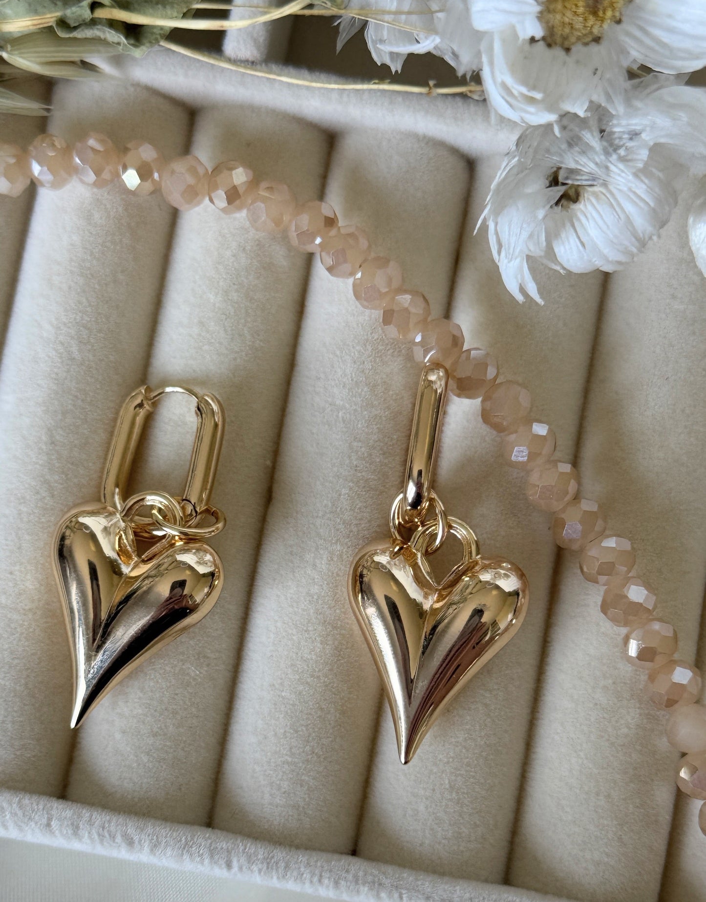Hematite golden crystal earrings styled with matching crystal necklace