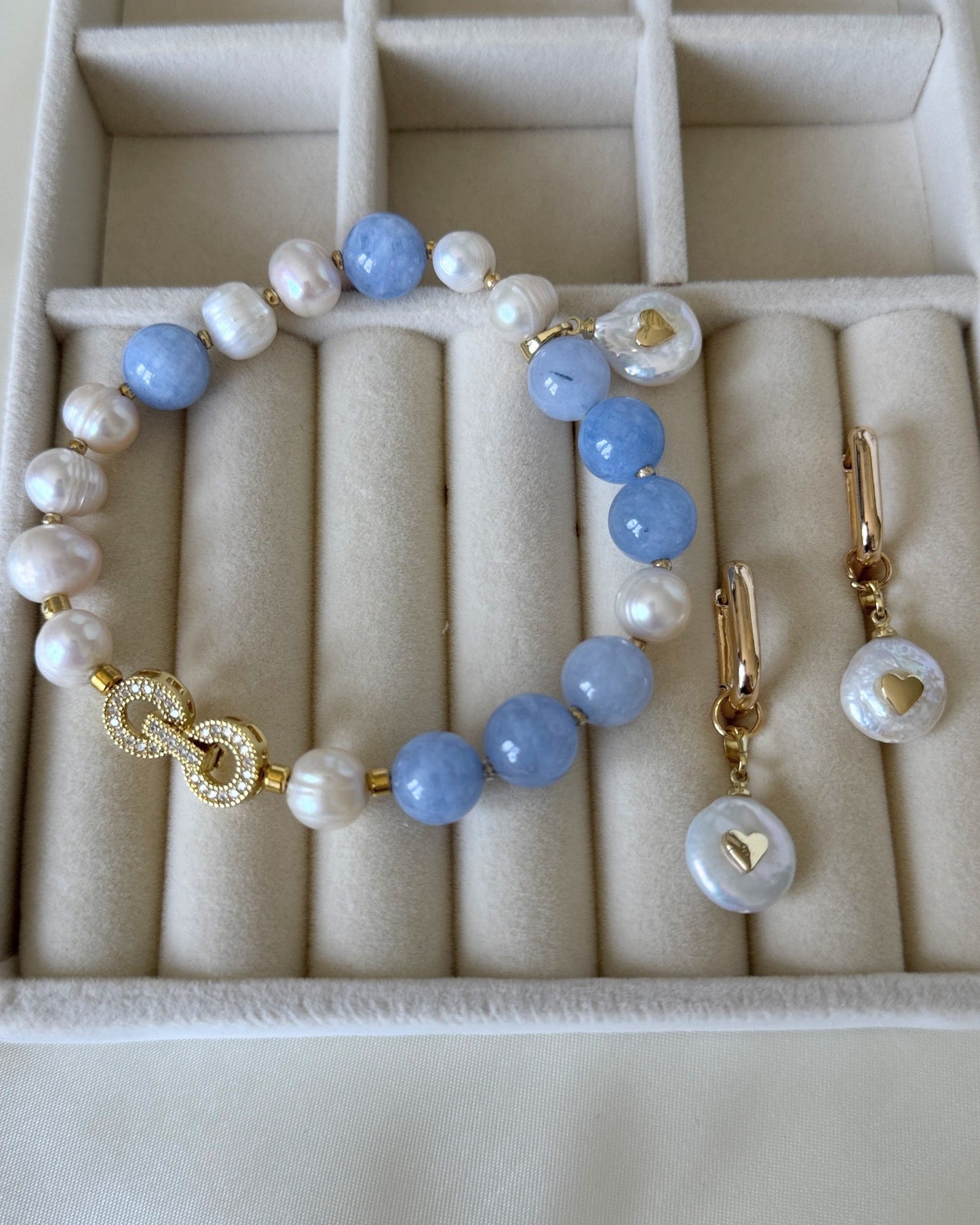 Elegant freshwater pearl and aquamarine necklace, earrings, and bracelet set