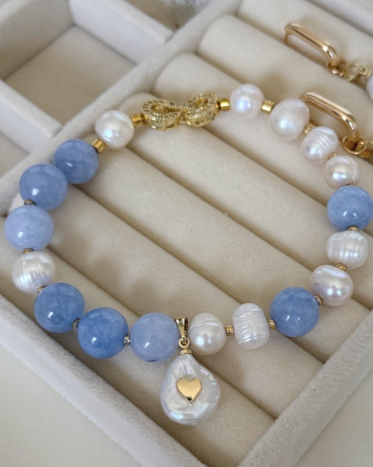 Pearl and aquamarine jewelry set with necklace, earrings, and bracelet