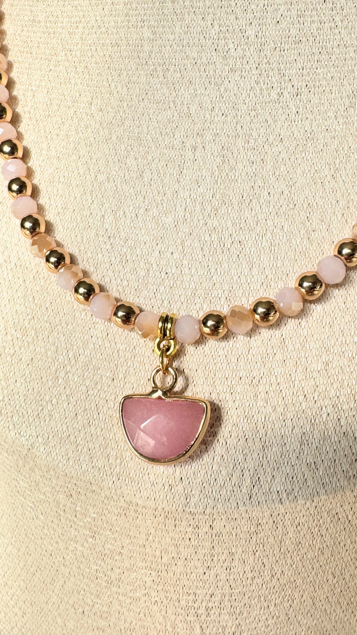 Close-up of light pink hematite beads and freshwater pearls on necklace