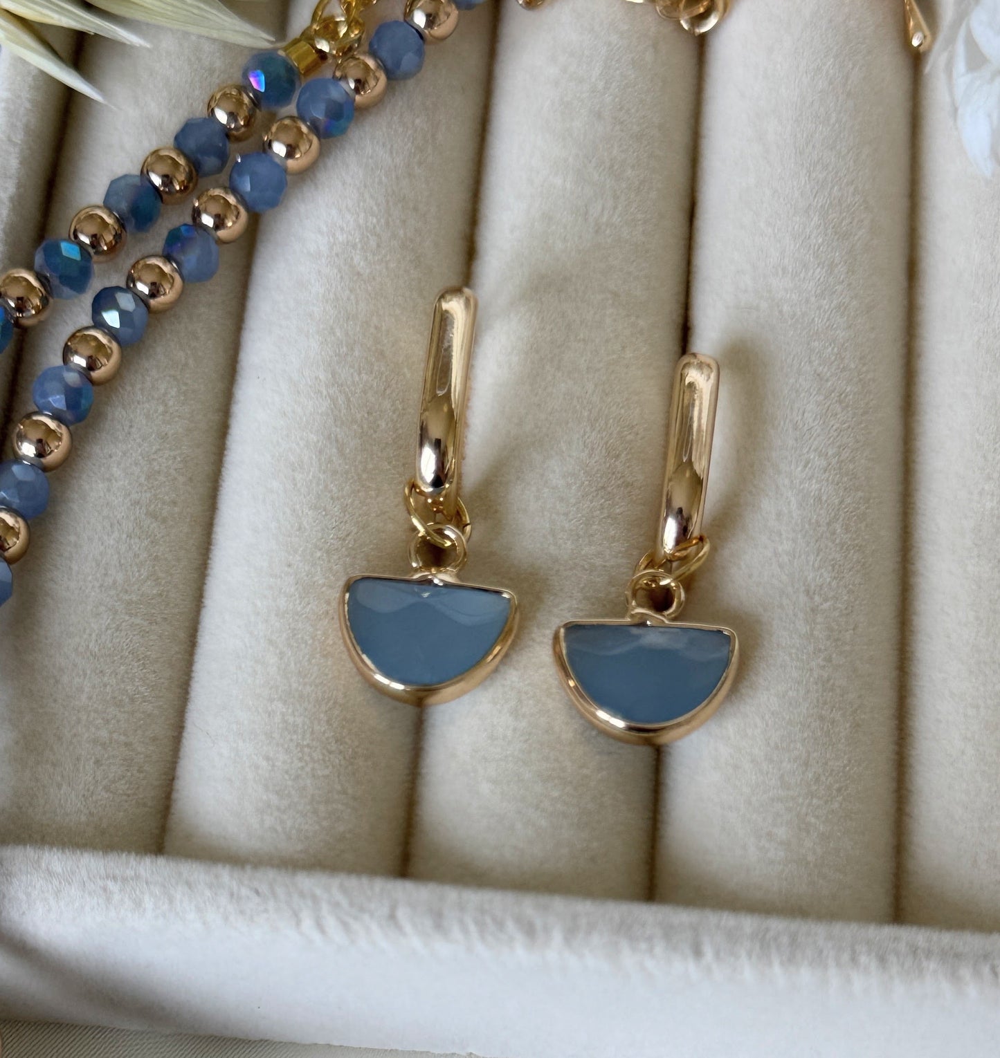 Close-up of blue gold hematite crystal necklace and earrings jewelry set