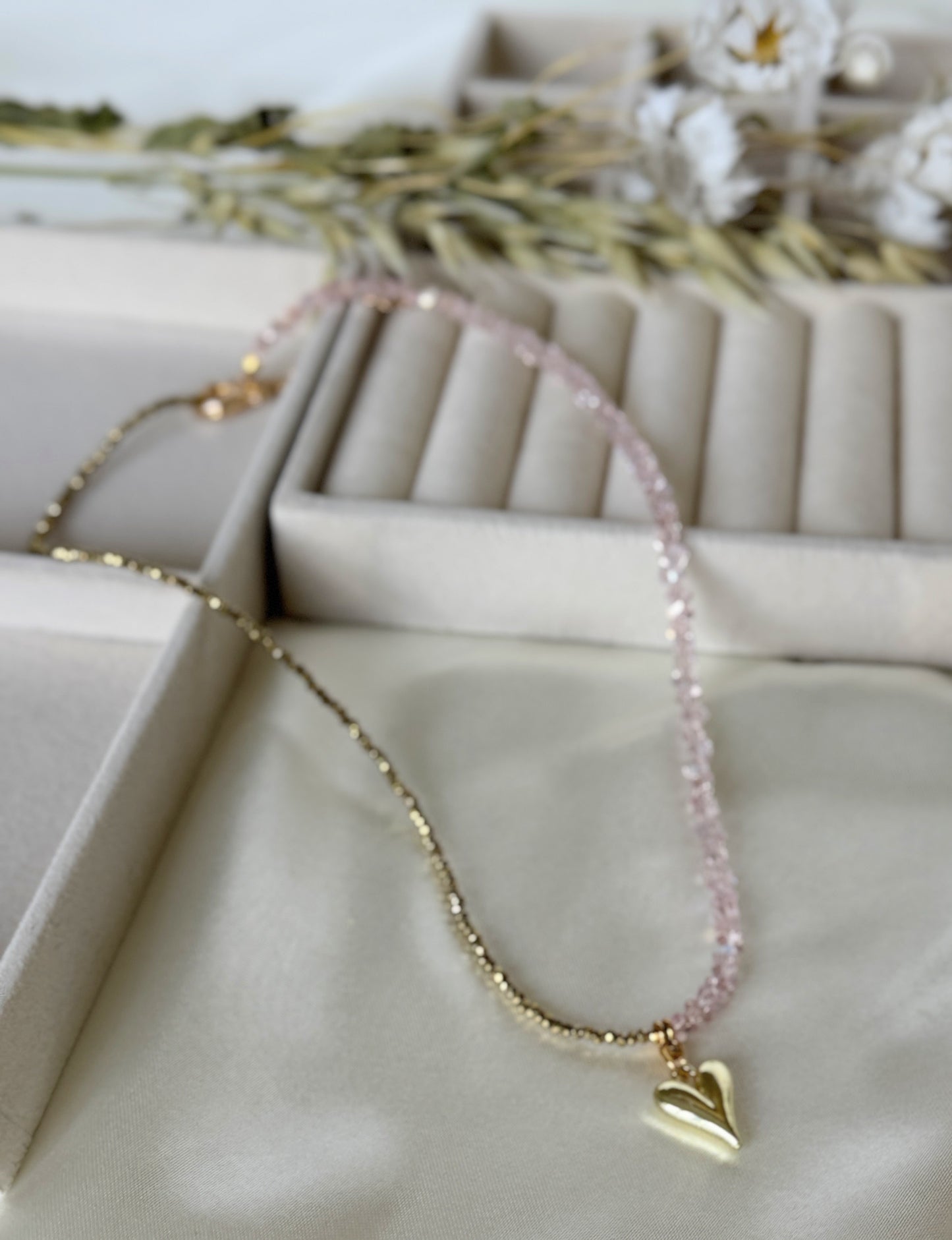 Close-up of pink gold hematite beads and crystals on layered necklace second variant