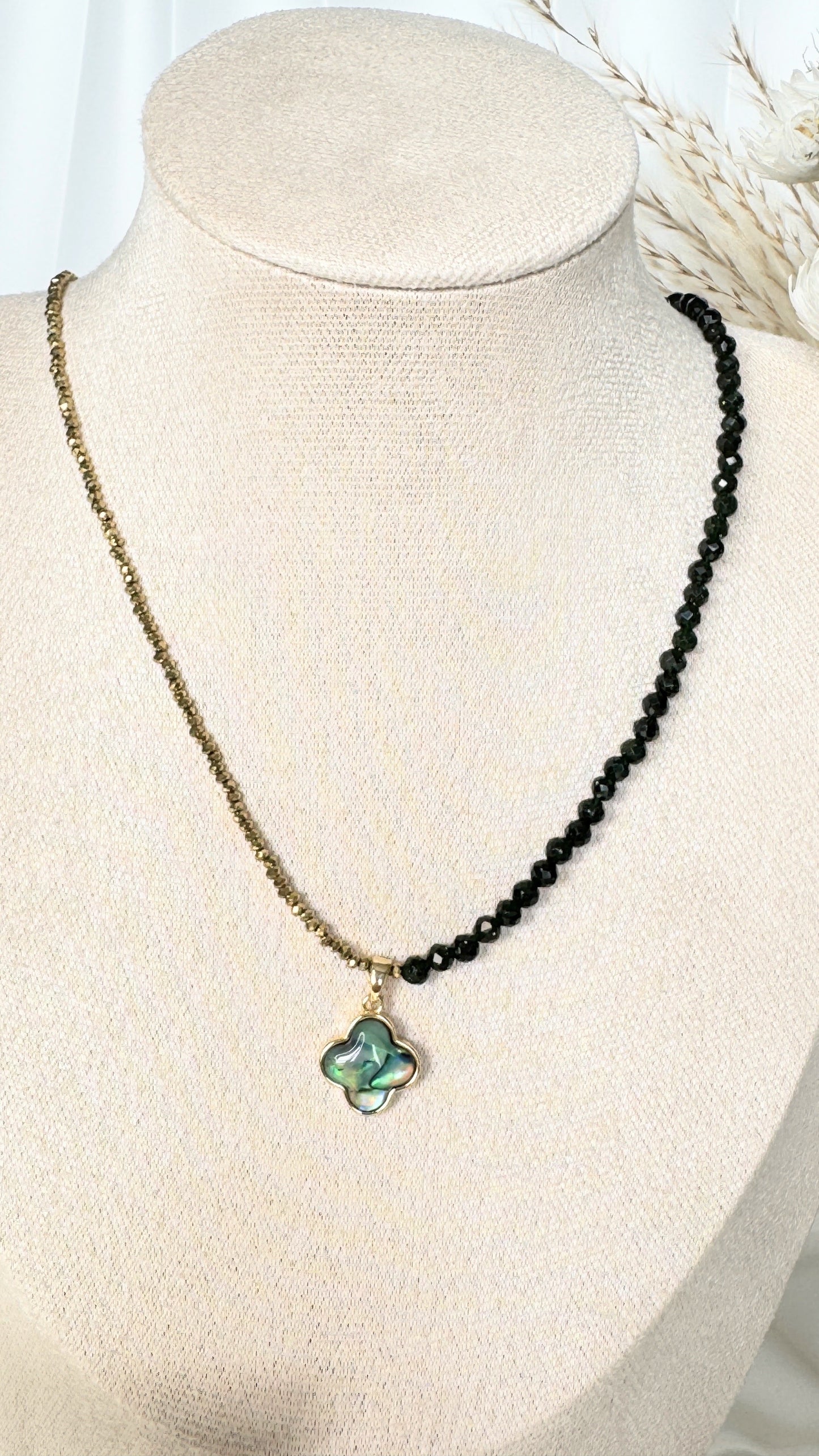 Adjustable clasp of lucky clover hematite crystal necklace with gold details