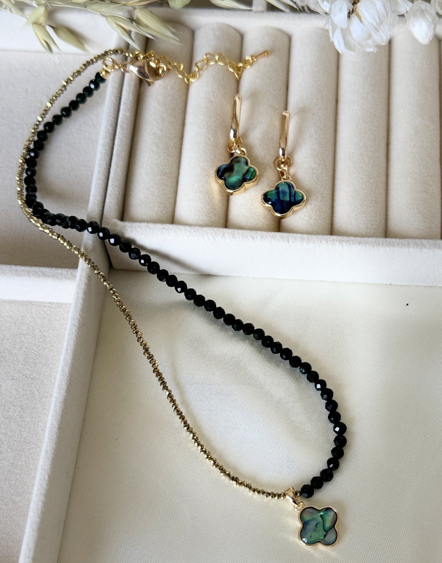 Elegant hematite crystal necklace with clover pendant and matching earrings