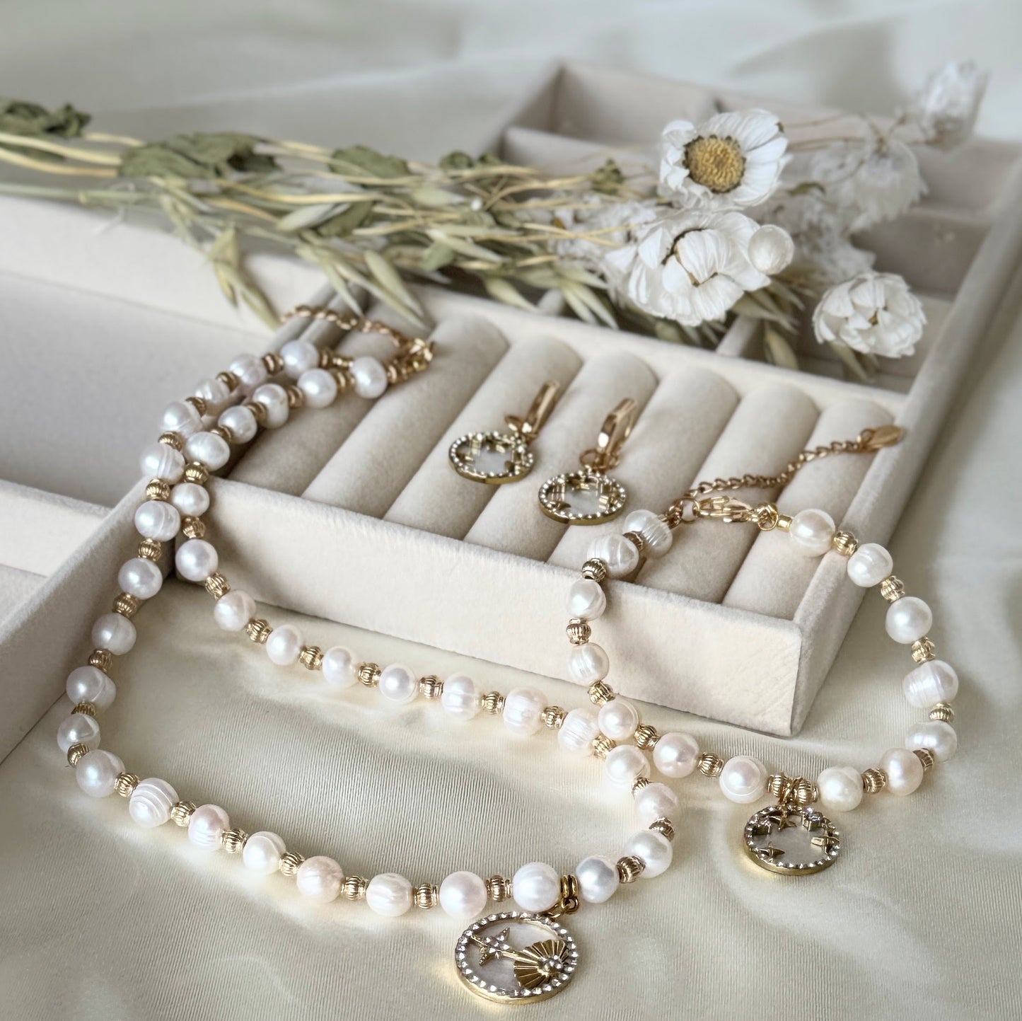 Mother-of-pearl jewelry set with necklace, earrings, and bracelet with gold accents
