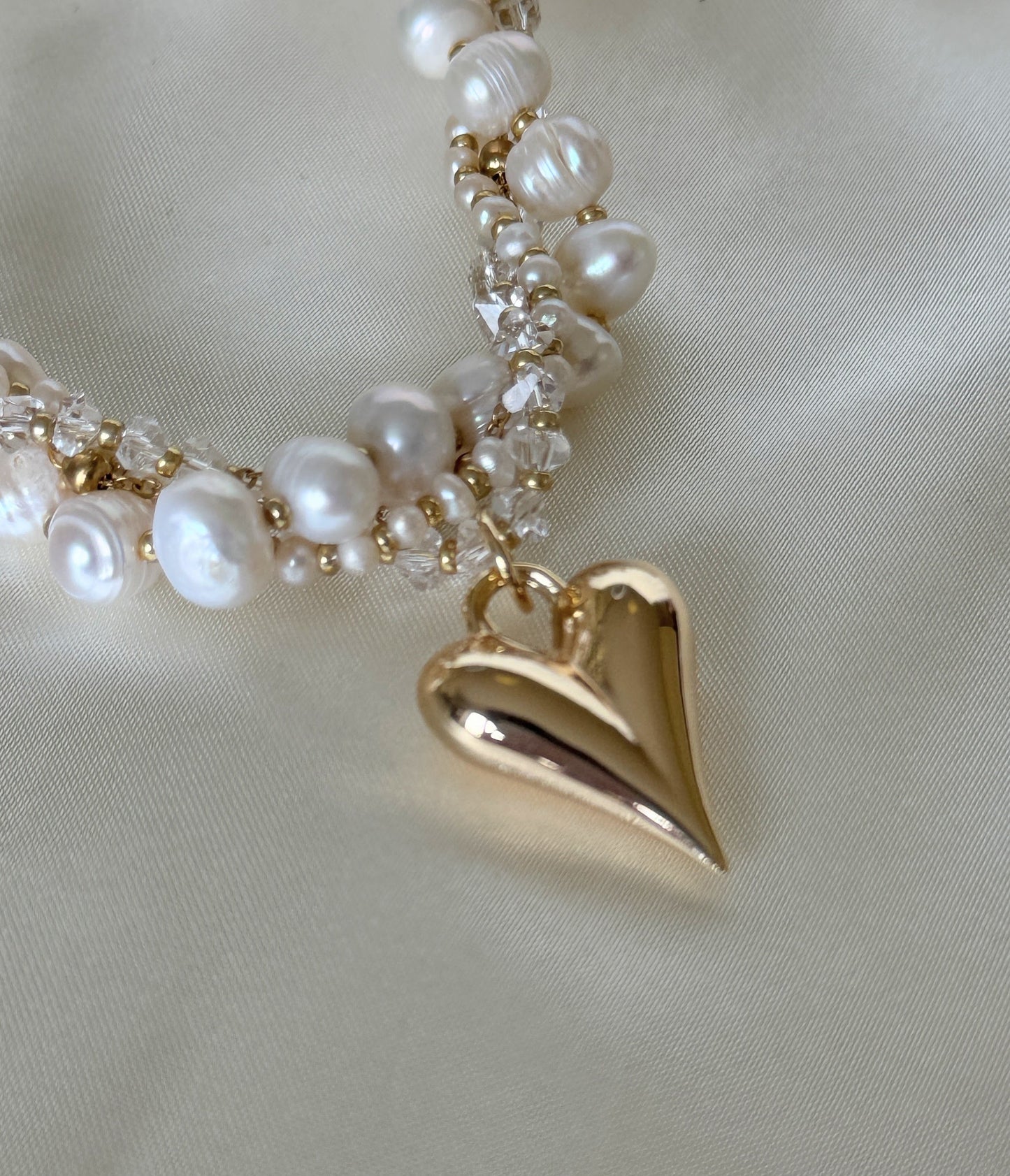Close-up of four-strand freshwater pearl necklace with crystals