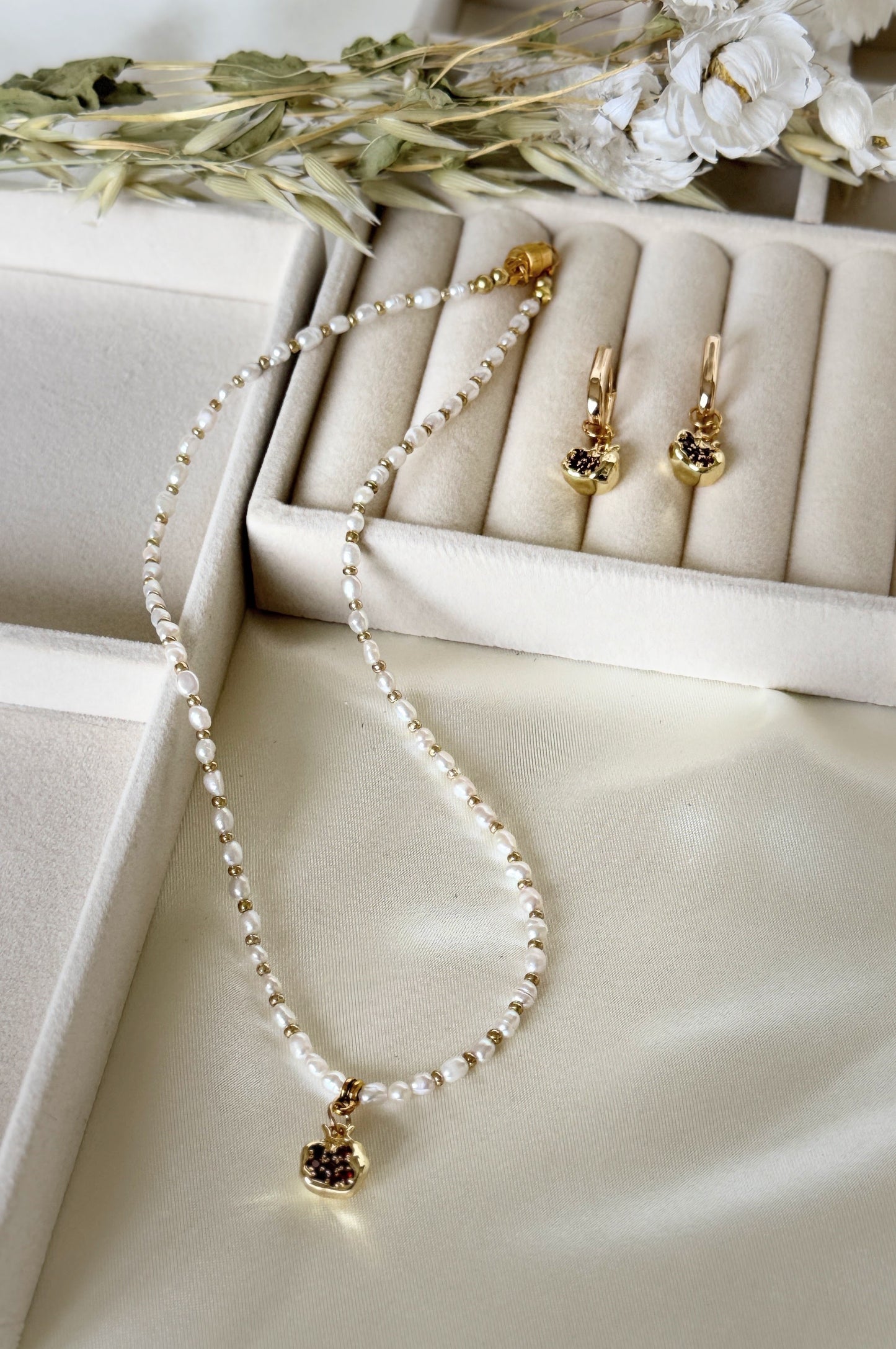 Golden pomegranate pearl necklace in Malvy Jewelry gift box