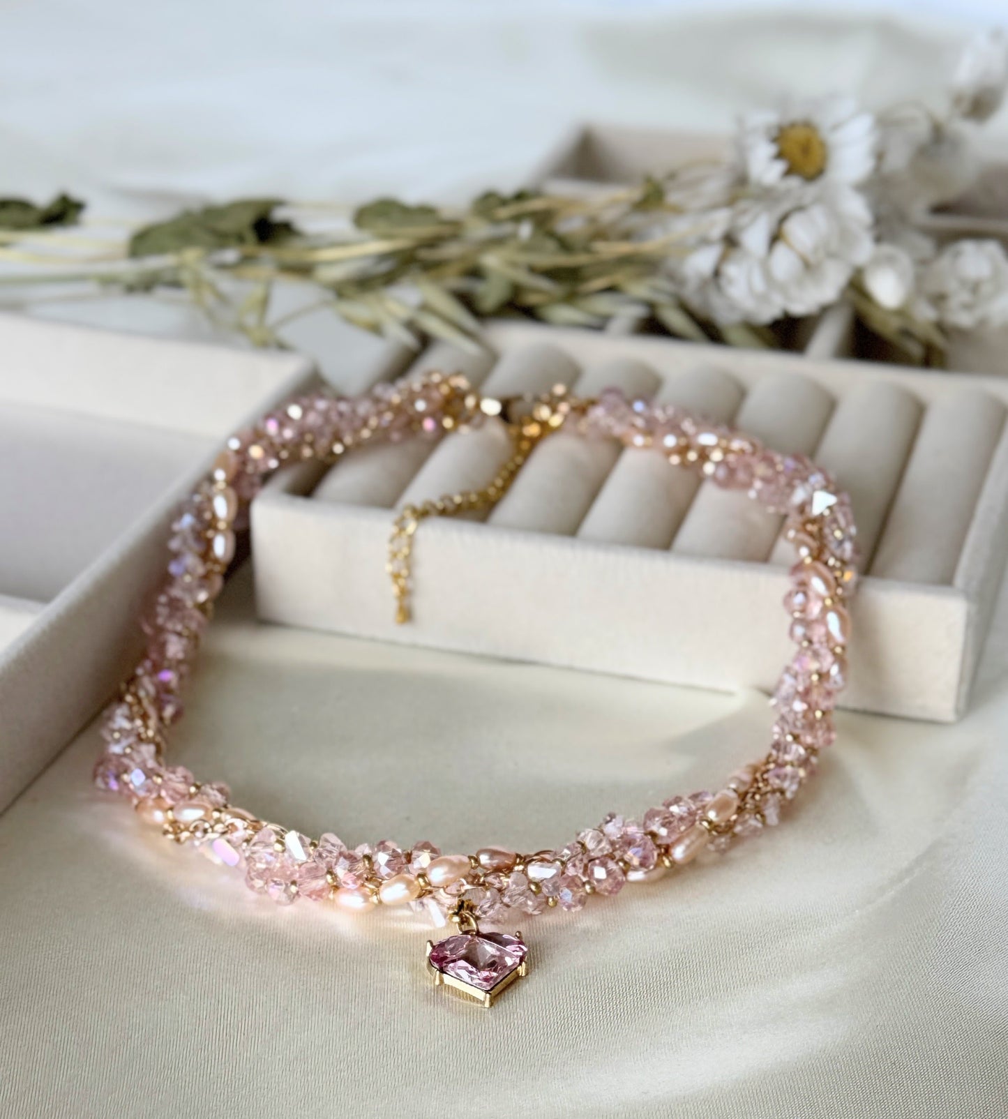 Detail shot of freshwater pearls on pink layered necklace second variant