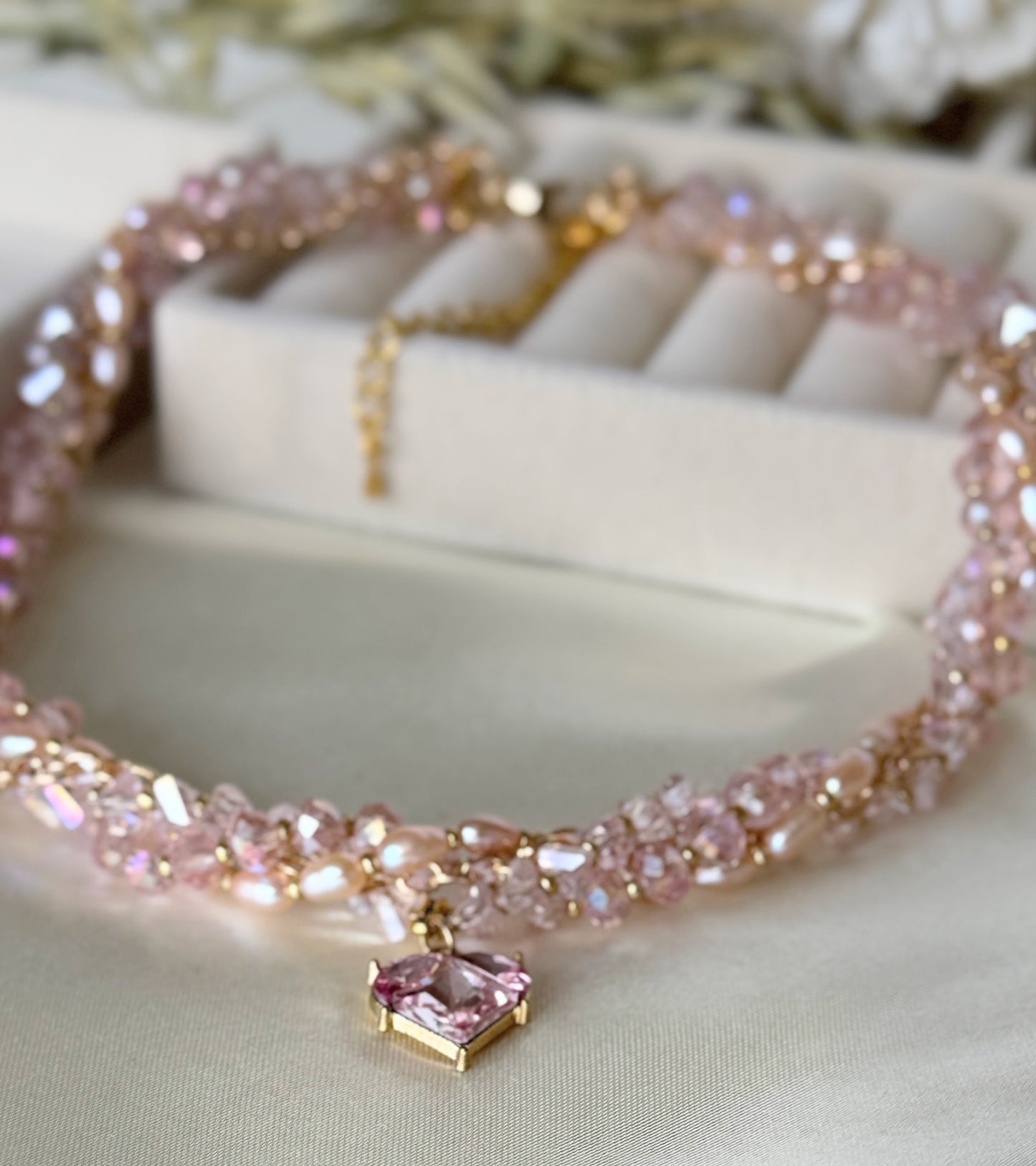 Close up - detail shot of freshwater pearls on pink layered necklace