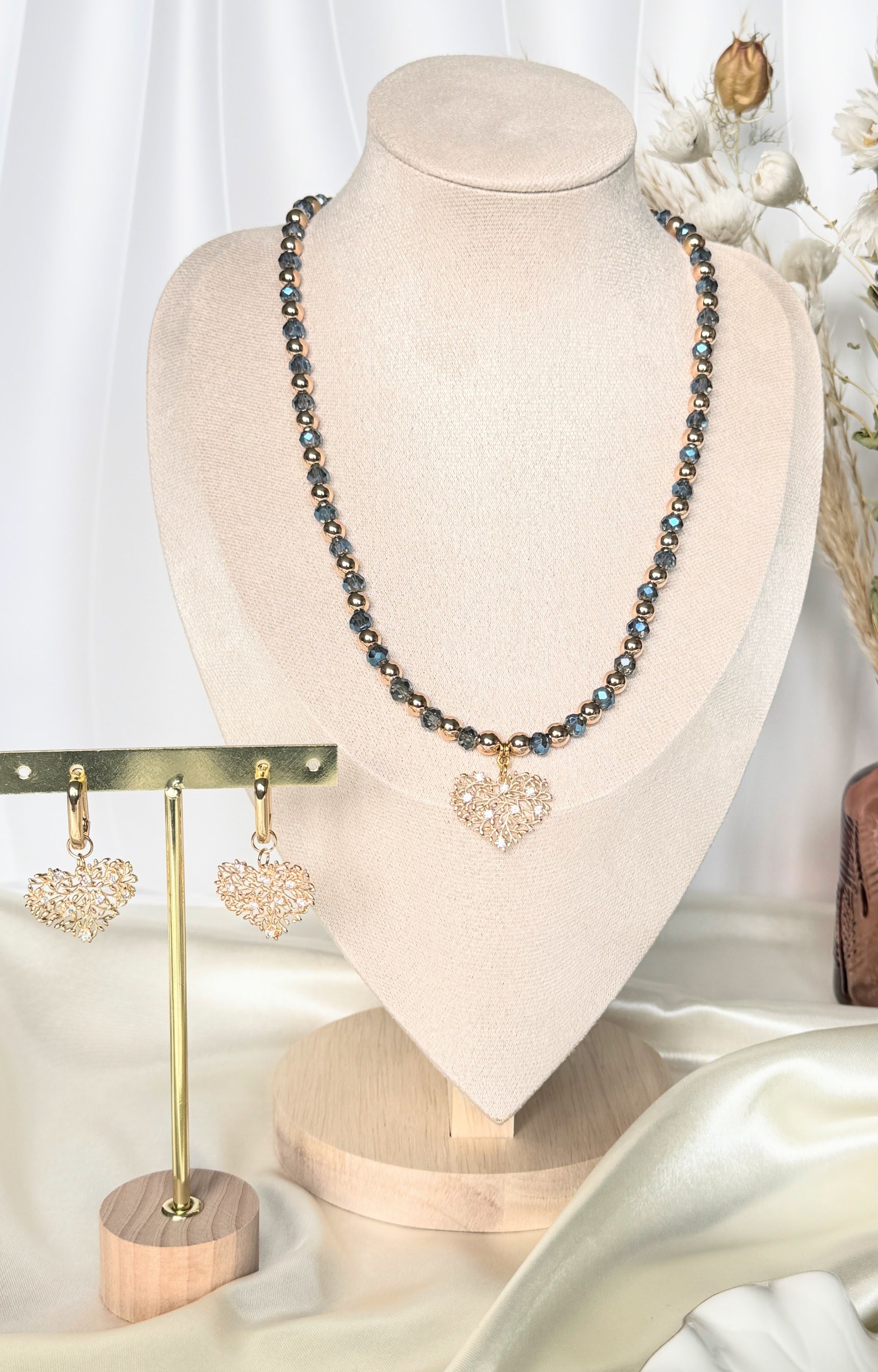 Layered blue crystal hematite necklace and earrings set with gold accents