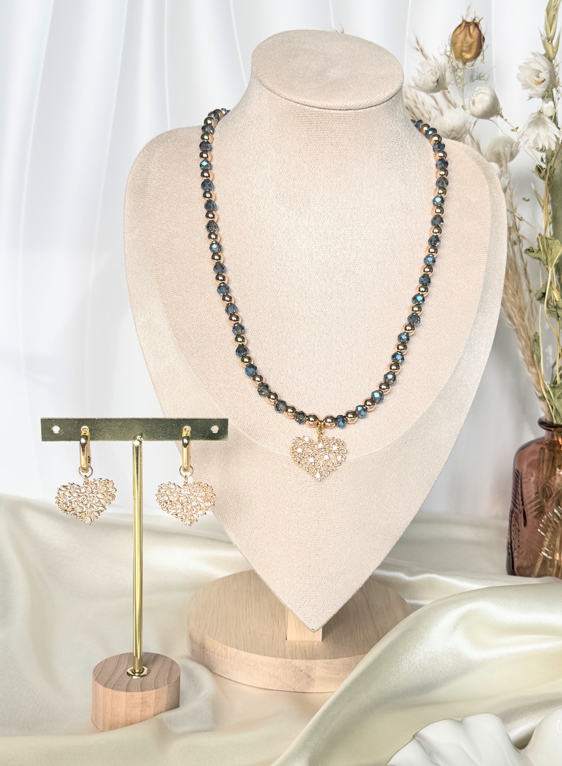 Close-up of tree blue crystal hematite necklace and earrings jewelry set