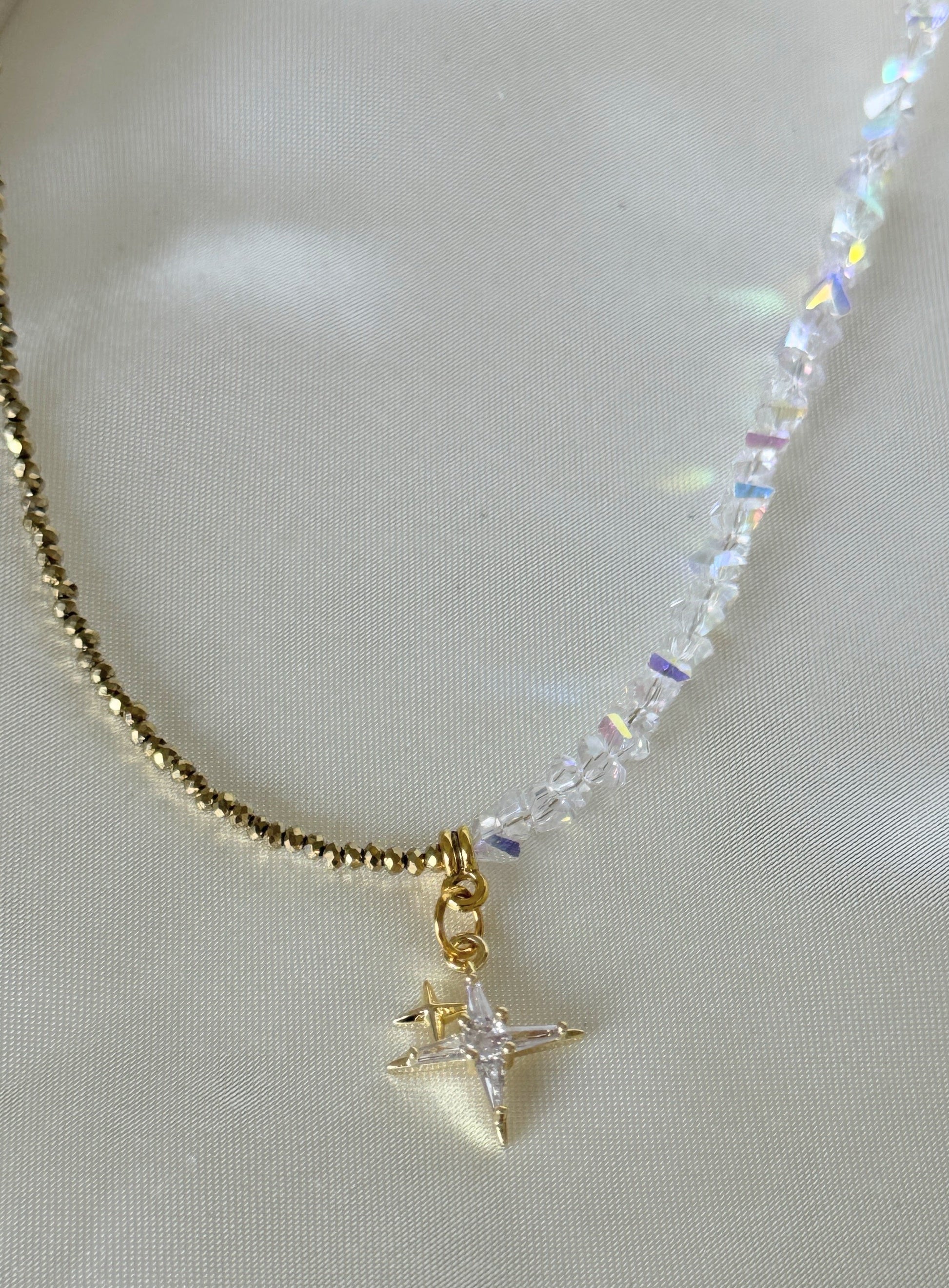 Elegant stars hematite crystal necklace displayed on soft fabric