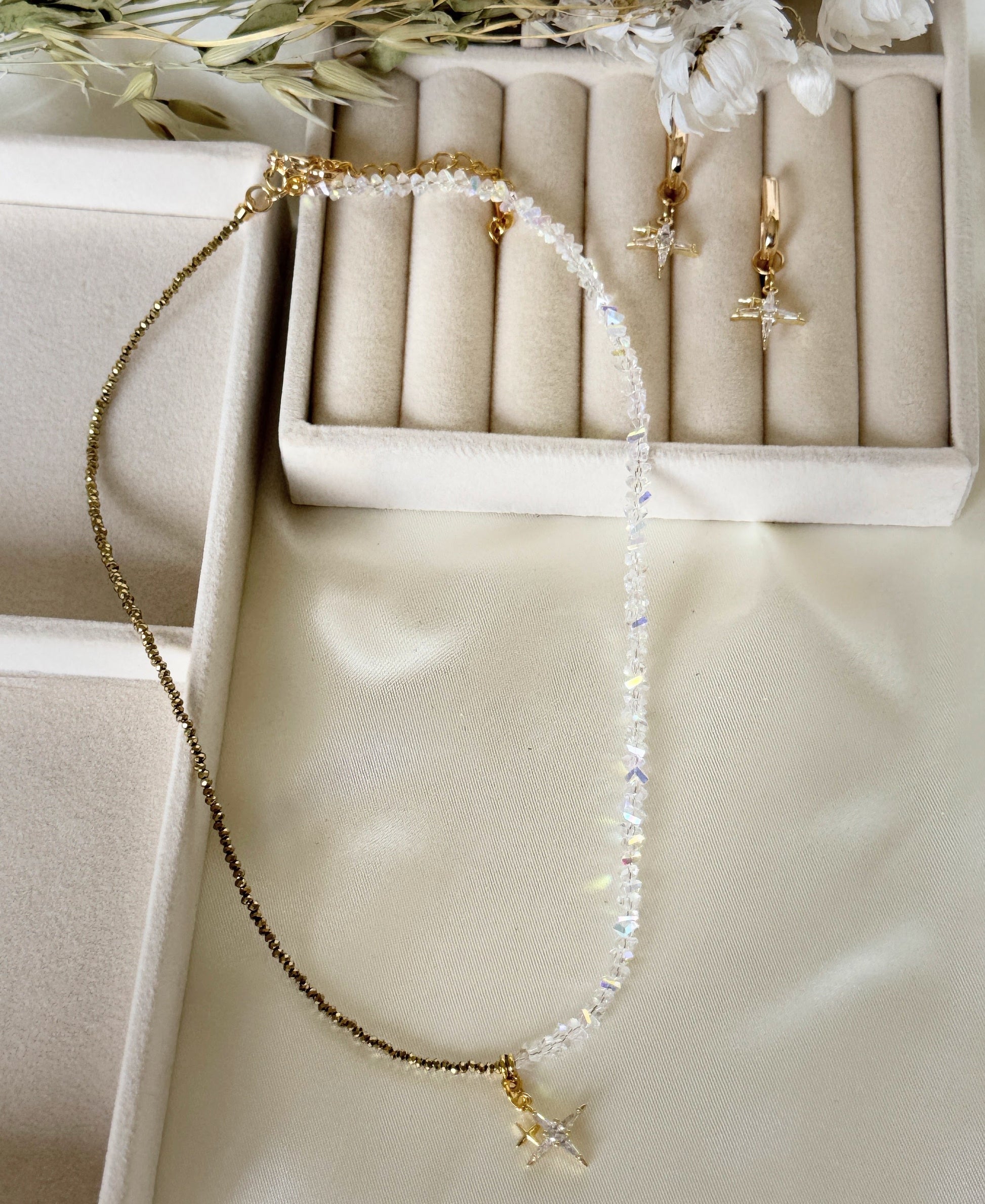 Close-up of stars hematite crystal necklace and earrings jewelry set