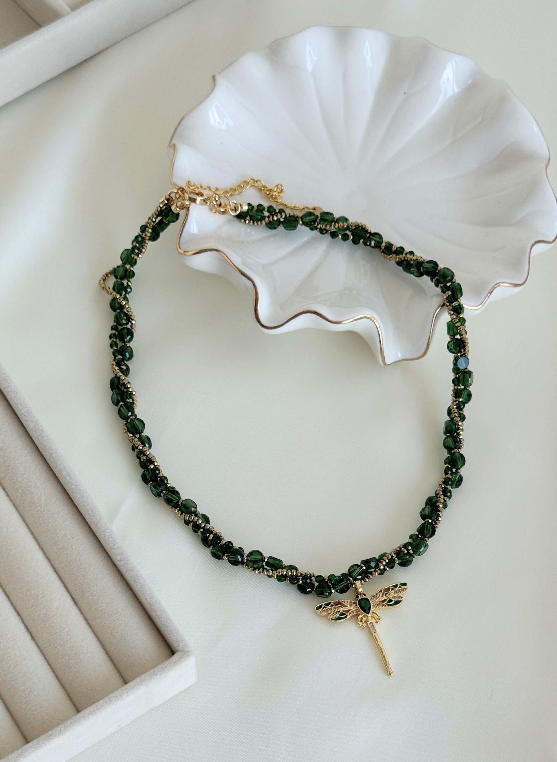 Adjustable clasp of green dragonfly crystal necklace with gold accents