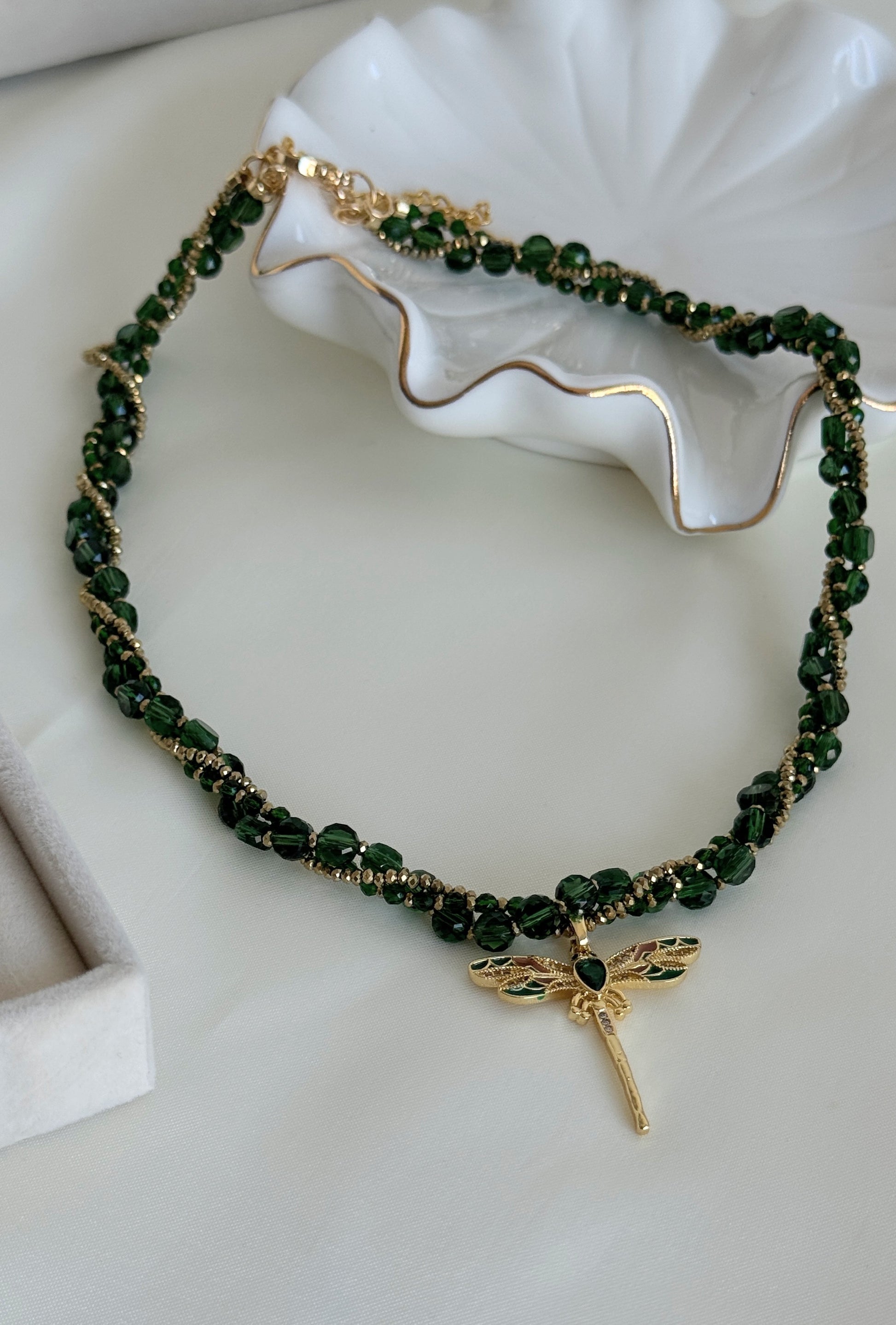 Layered green crystal necklace with gold dragonfly pendant