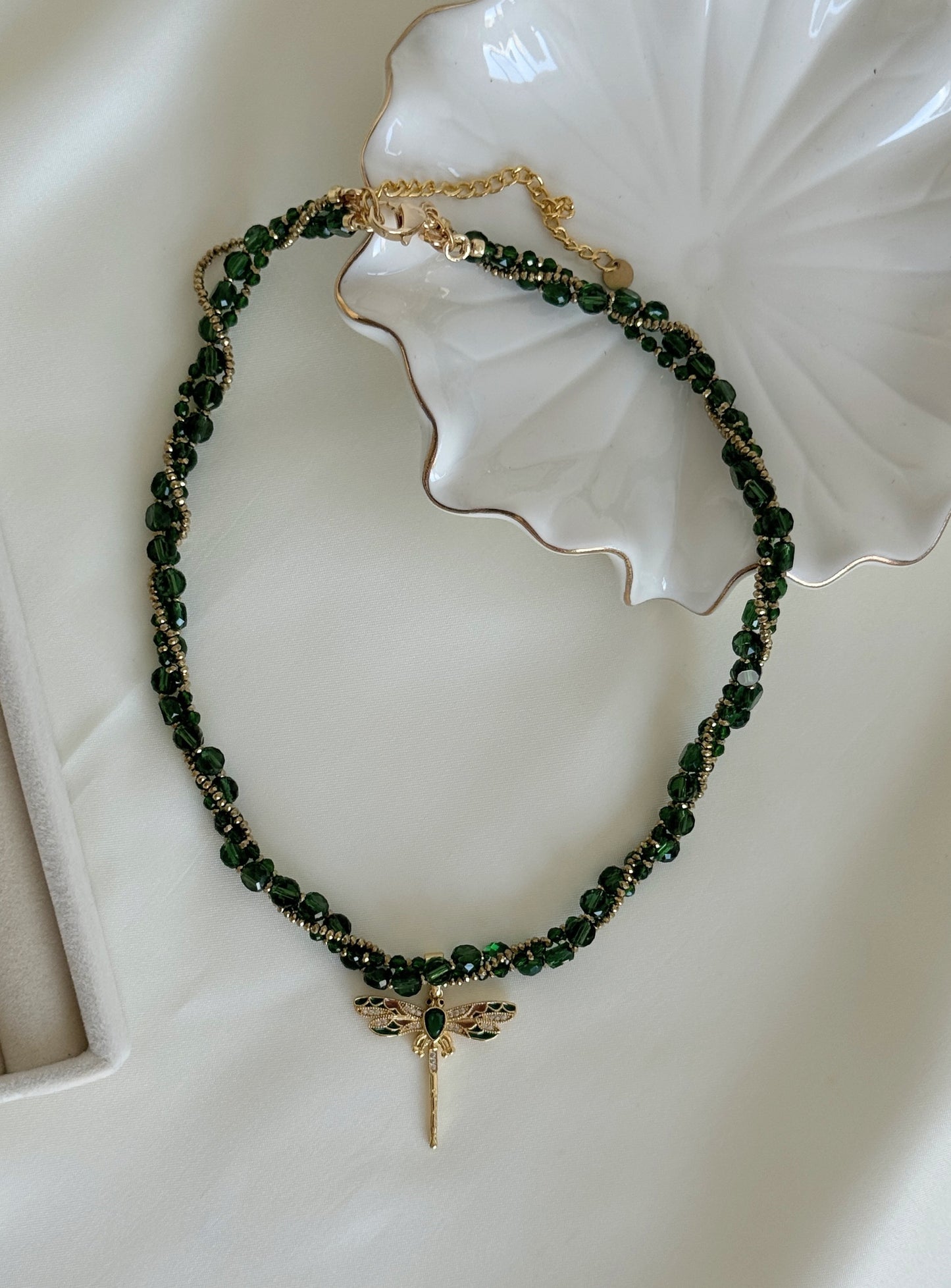 Gold dragonfly pendant on green crystal layered necklace