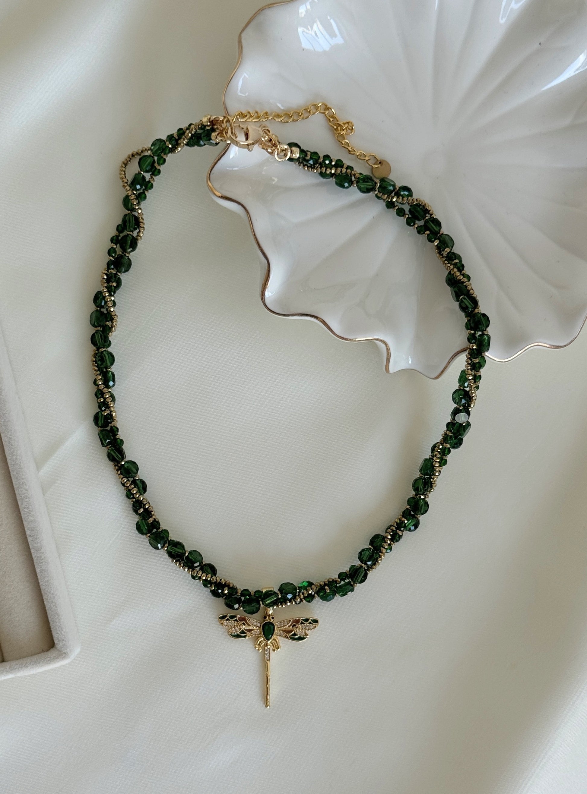 Gold dragonfly pendant on green crystal layered necklace
