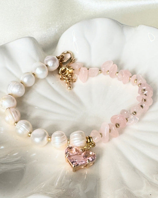 Close-up of freshwater pearl and pink quartz bracelet with gold details