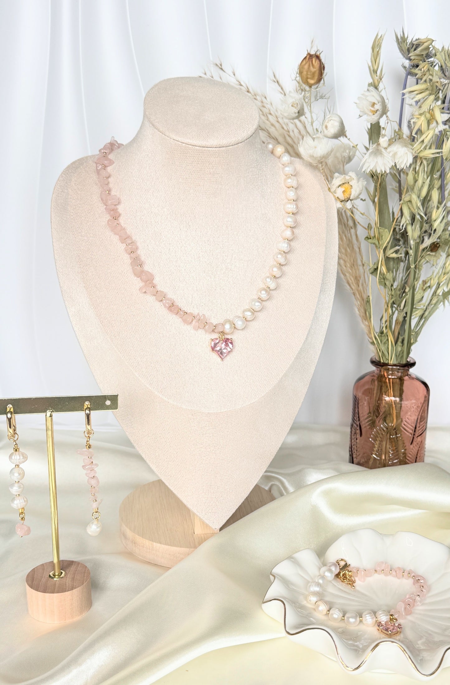 Elegant pink quartz beaded necklace, pearl earrings, and bracelet set