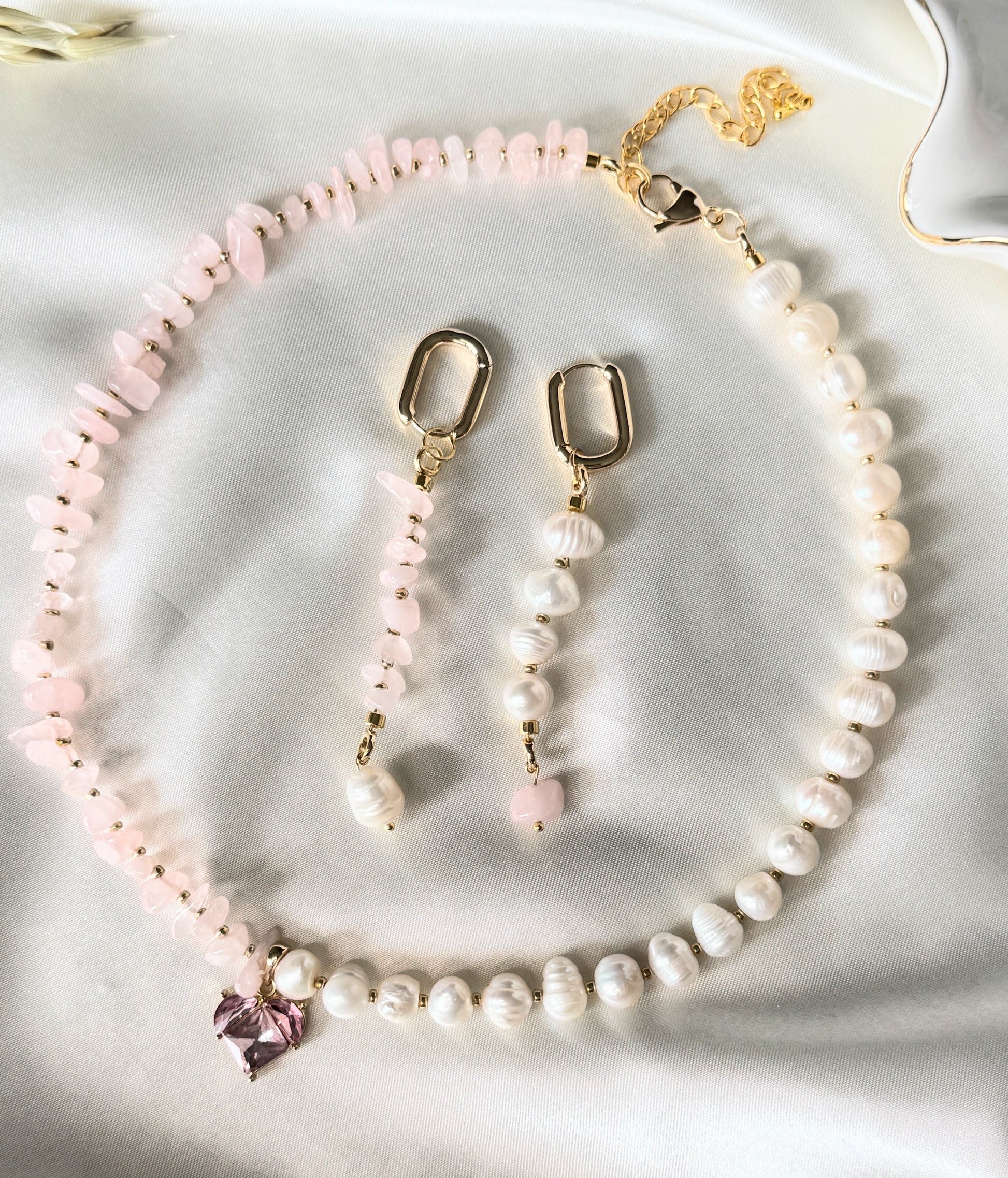 Pink quartz crystal and pearl jewelry set with necklace, earrings, and bracelet
