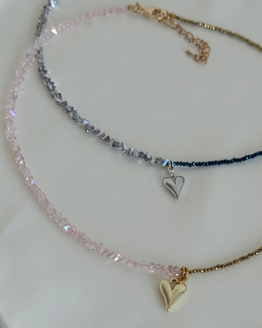 Deep grey hematite beads interspersed with small gold spacer beads, forming a refined necklace strand of two necklaces