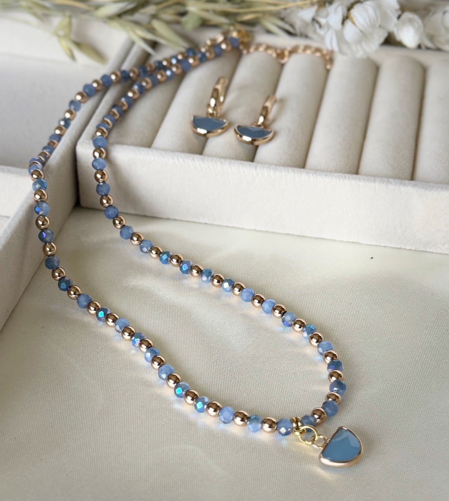 Elegant blue gold hematite crystal necklace paired with matching earrings