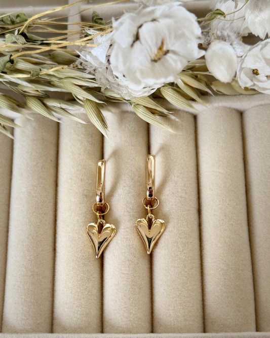 Close-up of pink gold hematite crystal earrings with dangling design