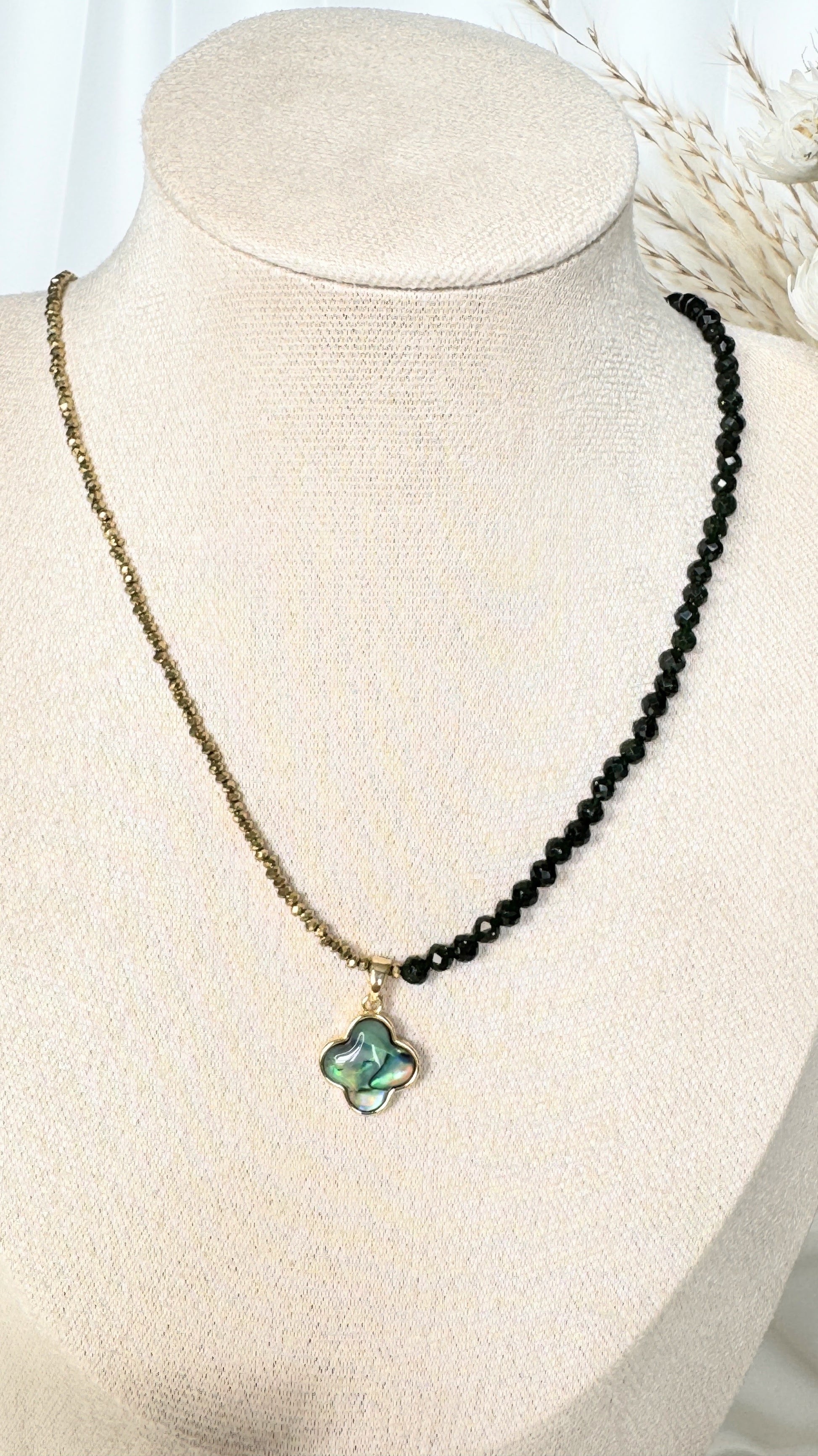 Adjustable clasp of lucky clover hematite crystal necklace with gold details
