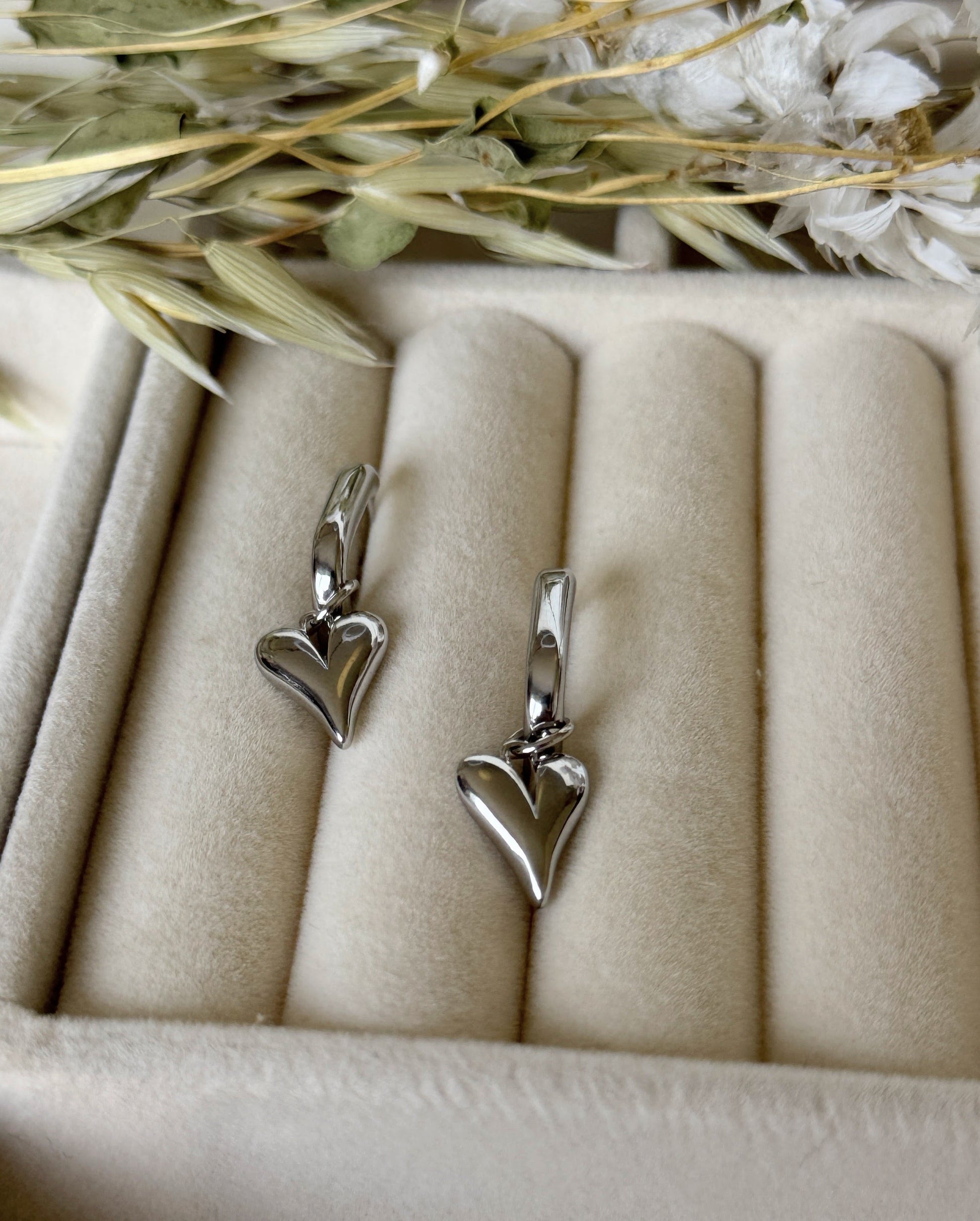 Hematite silver crystal heart earrings with dangling design