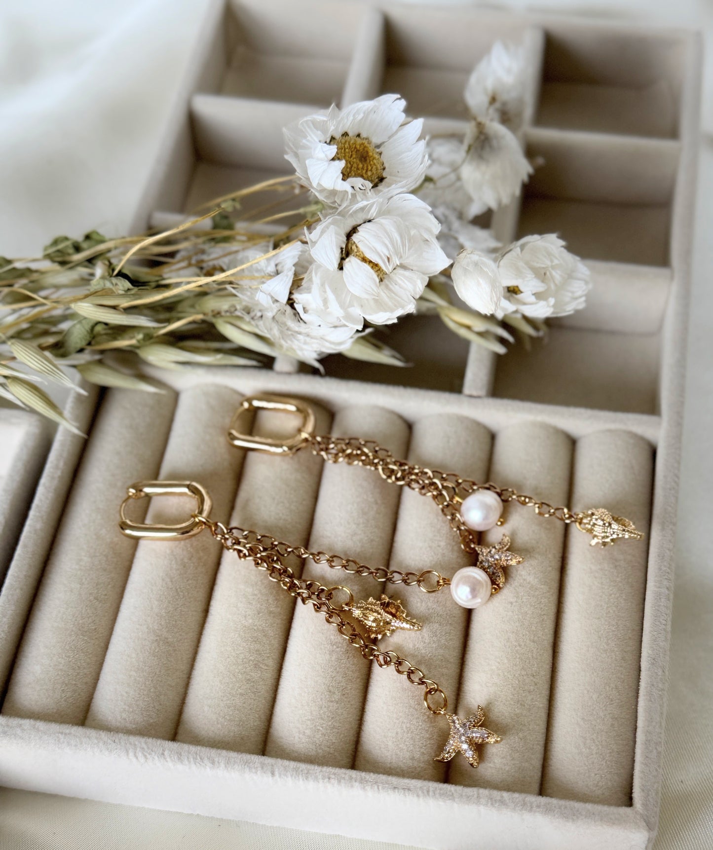 Close-up of golden sea pearl earrings with delicate gold accents