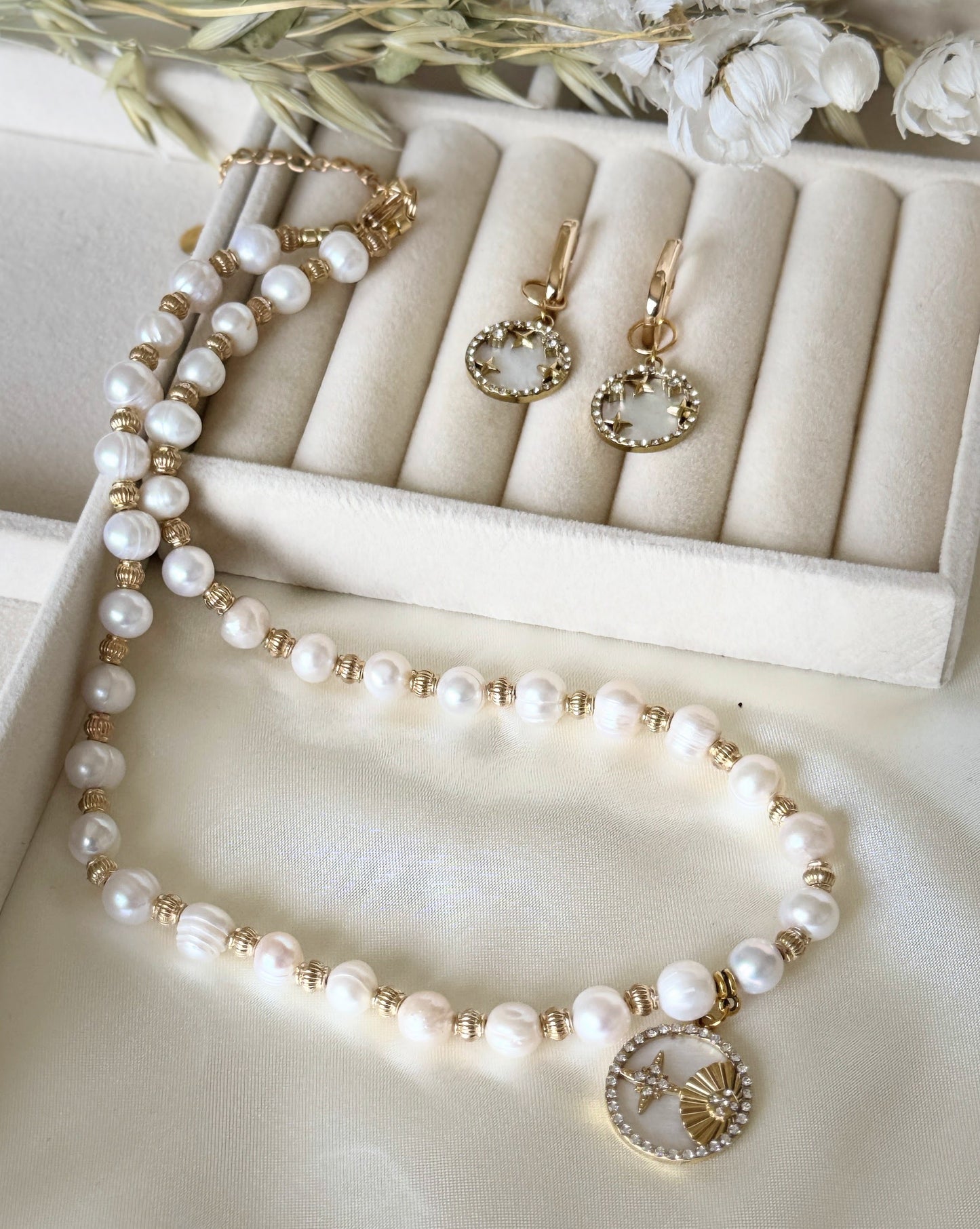 Premium mother-of-pearl jewelry set with necklace and earrings on display
