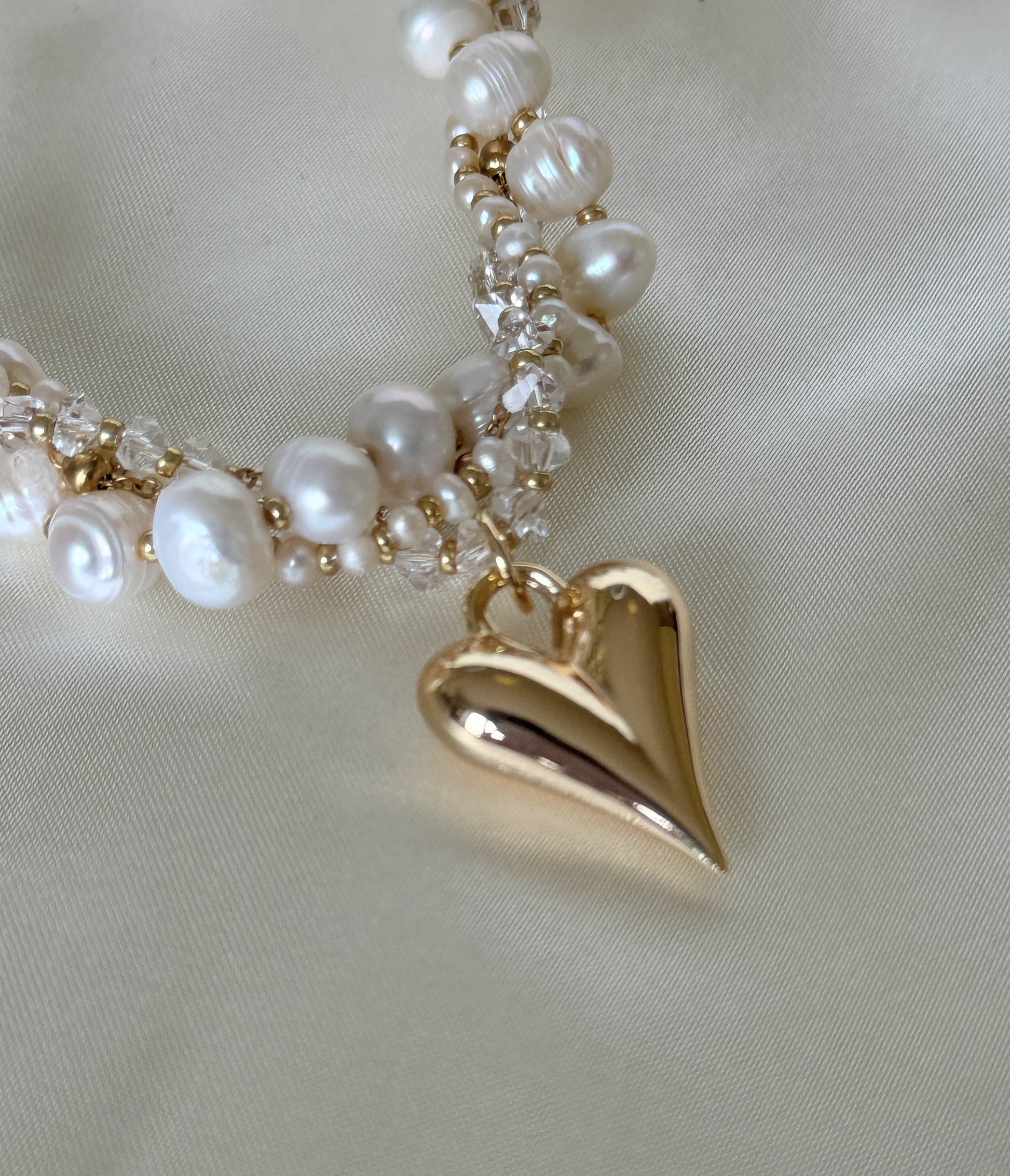 Close-up of four-strand freshwater pearl necklace with crystals