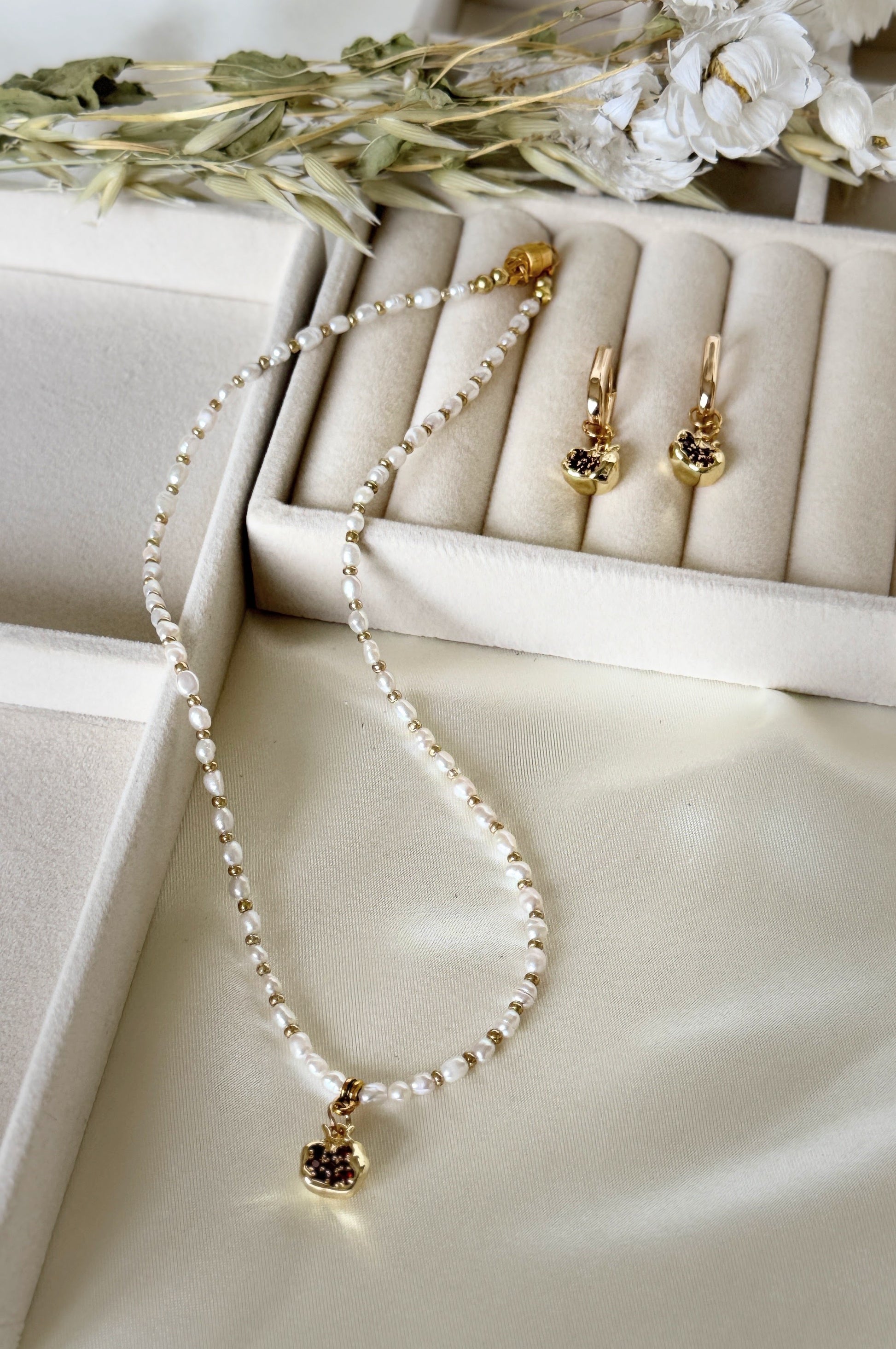 Golden pomegranate pearl necklace in Malvy Jewelry gift box