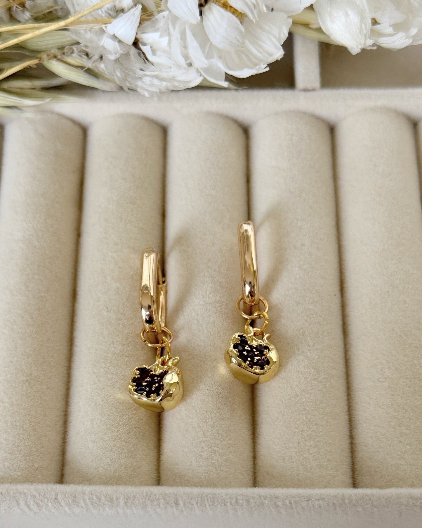 Golden pomegranate earrings with deep red garnet beads and gold hooks